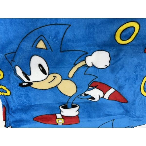 Imagen de Sonic, el erizo azul, en un fondo azul con anillos dorados.