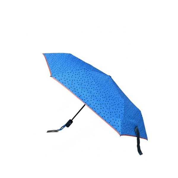 Sombrilla azul con puntos negros para protección contra el sol.