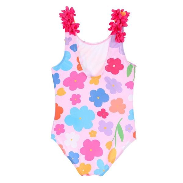 Traje de baño infantil con flores y detalles en las hombreras rosas.