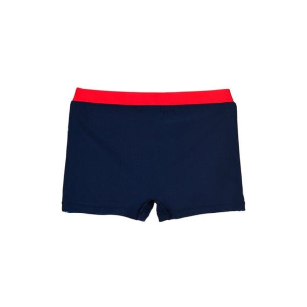 Bañador de niño con pantalones cortos azul marino y cinturilla roja.